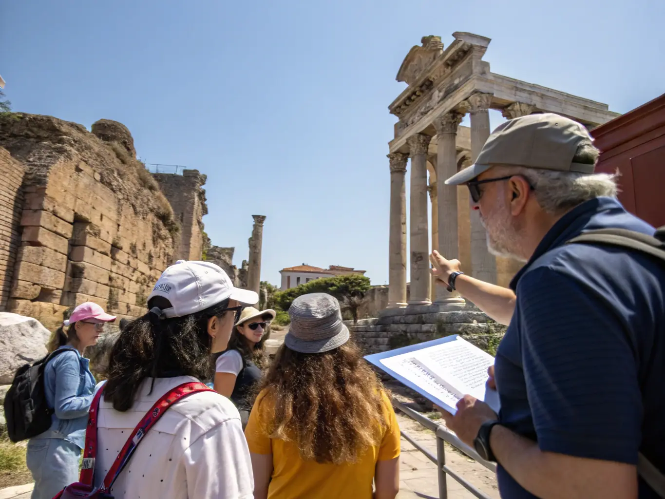 A photograph of a historian leading a guided tour of a historical site in the Rupificaldien region, emphasizing the importance of local heritage education.